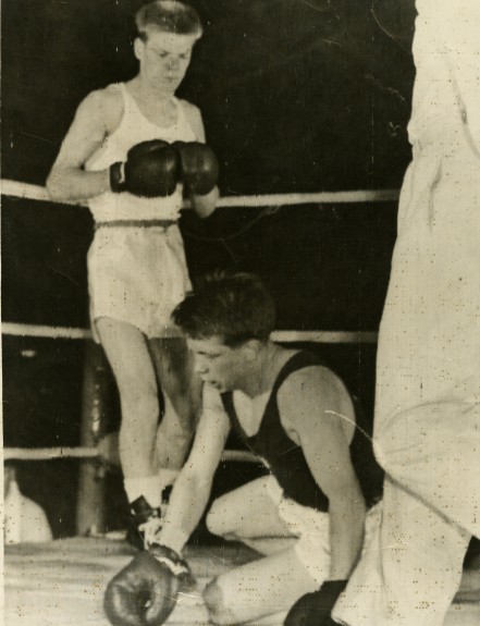 Dick McTaggart has H Kurschat of Germany on the canvas during their Olympic  lightweight final in Melbourne, Australia.