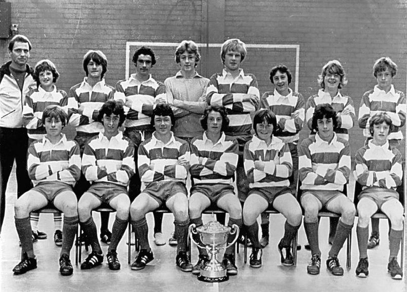 Menzieshill U/15 footballers with the Dundee United Cup in 1978-79. Back row (from left) — Mr Graeme Rodger, E Robertson, T Mitchell, G Walker, I Martin, S McMahon, G Scott, R Stewart, L Cuthill. Front — J Cochrane, G Ritchie, K Thoms, S Kerr, E McAulay, G Caswell, K Docherty.