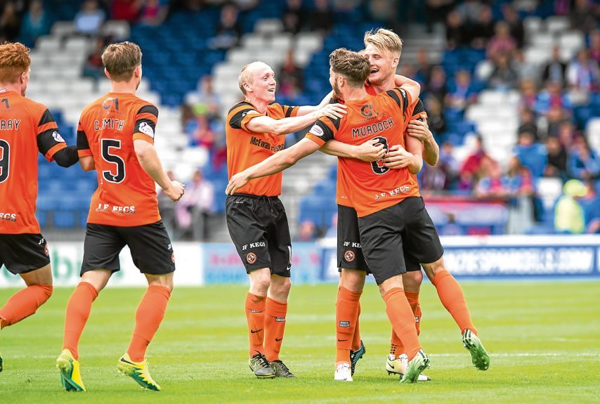 Willo Flood and Coll Donaldson congratulate Stewart Murdoch on scoring the equalising goal against Inverness in the League Cup.