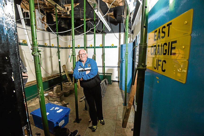 Club treasurer Willie Lawrence inside the damaged changing rooms.