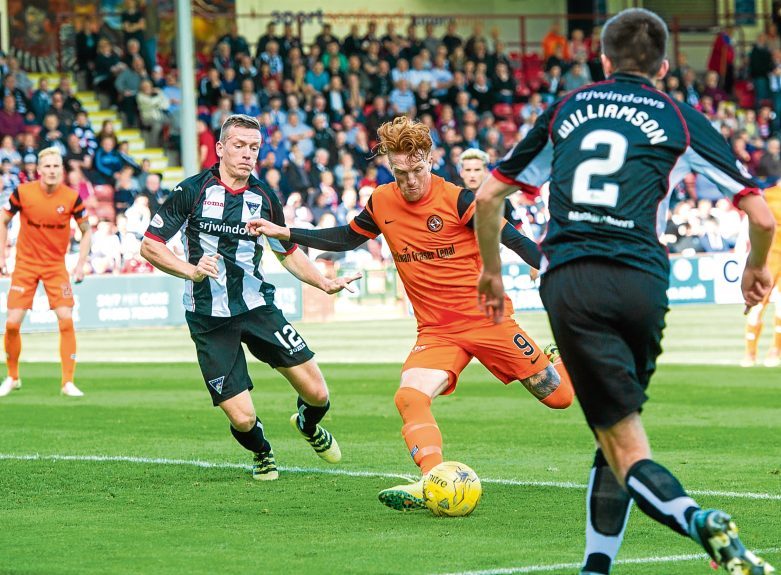 Simon Murray opens the scoring against the Pars in September.