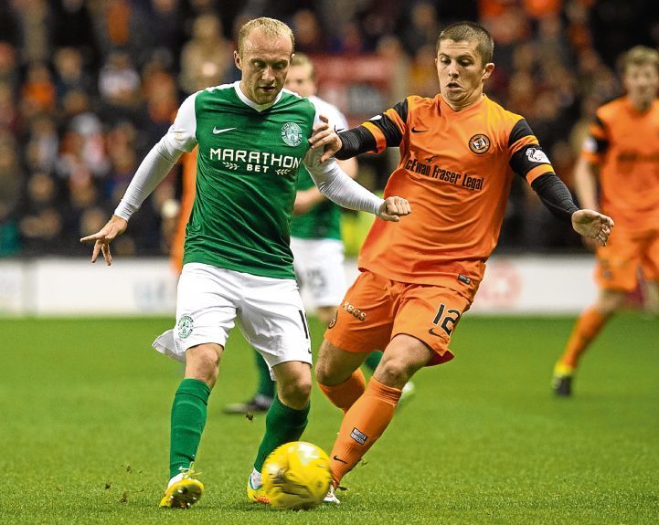 Charlie Telfer battles for the ball against Hibs’ Dylan McGeouch.
