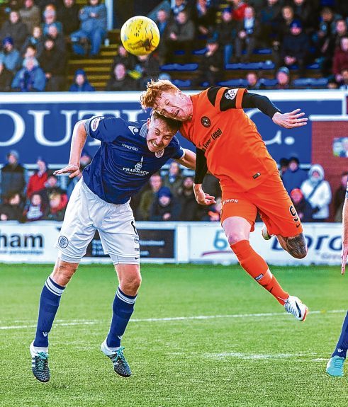 Simon Murray clashes with Chris Higgins at Palmerston in November.