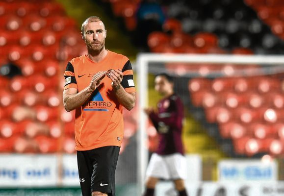 21/03/17 SEAN DILLON TESTIMONIAL   DUNDEE UNITED v HEARTS  TANNADICE PARK - DUNDEE  Dundee United's Sean Dillon applauds the supporters at his testimonial match