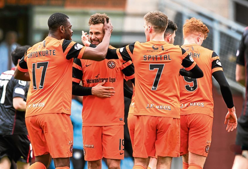 Wato Kuate congratulates Tony Andreu after the Frenchman scored United’s second goal against St Mirren on Saturday.