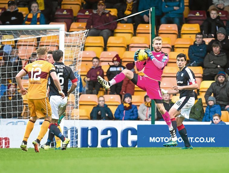 Scott Bain clutches a cross during Dundee’s 5-1 win over today's opponents Motherwell.