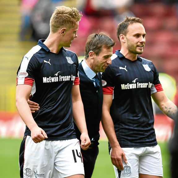 Neil McCann congratulates Mark O’Hara (left) and Tom Hateley following the win at Motherwell.