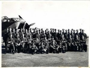 T20_Son's last visit to war hero crash site_01_no_Flt Sgt Robert James, middle row, standing behind his squadron's commander, seated in the centre.
