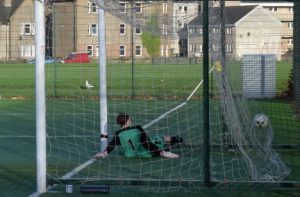 The ball hits the back of the net after Daniel Docherty's free kick. 50c47carradale04