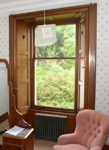 Hearts cut in window shutters.