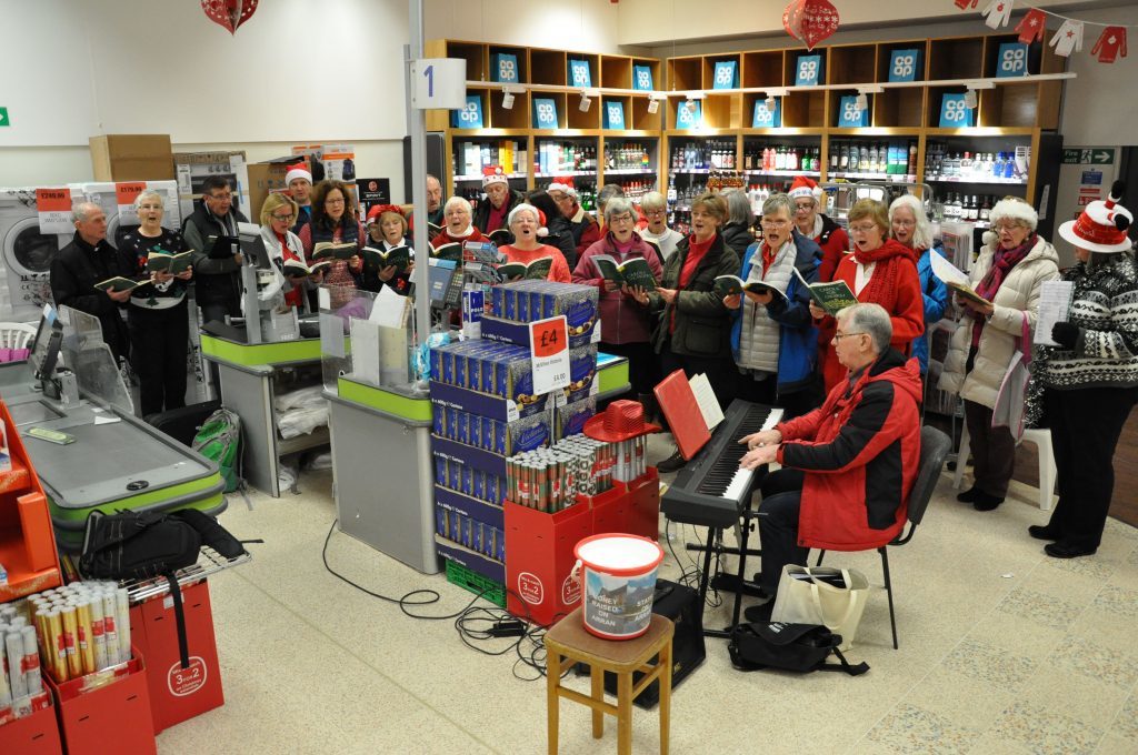The Arran Singers perform a host of Christmas carols during an afternoon performance at the Brodick Co-op