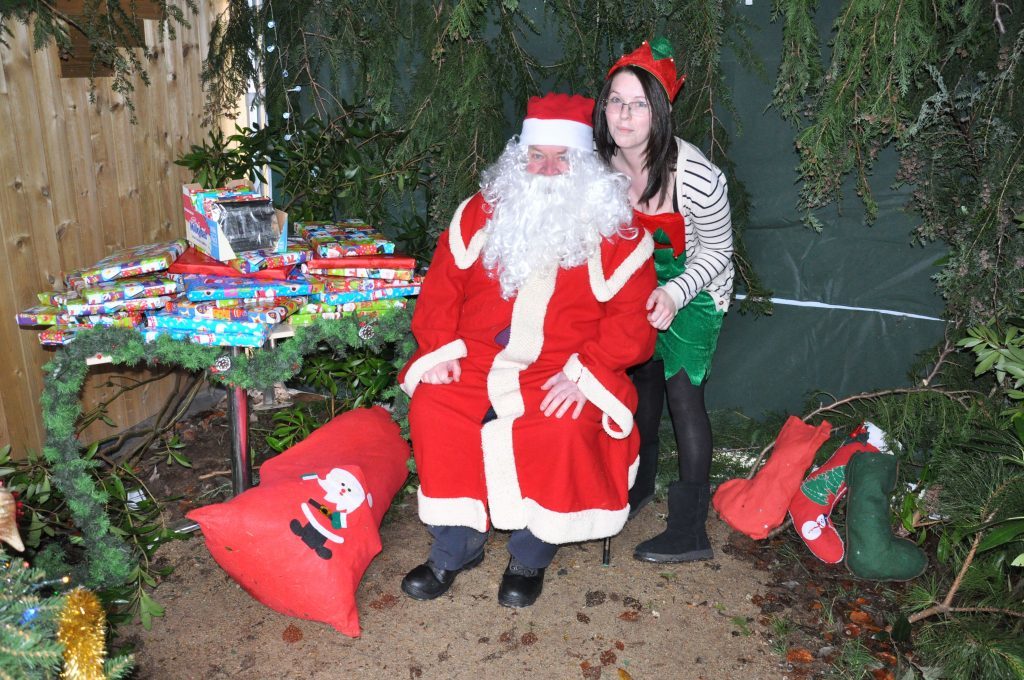 Santa and his elve helper prepare to meet children in the Isle Be Wild play park grotto