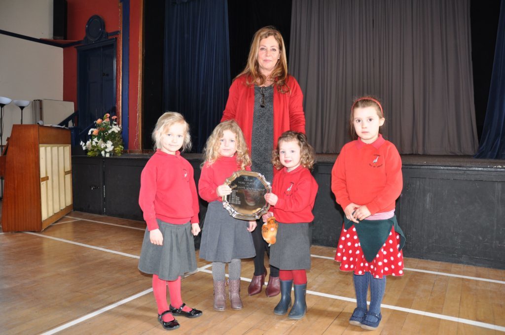 Adjudicator Lesley Wilson presented the Kilmory Early Years class with the Nancy Cooper Memorial Trophy in the actions songs section