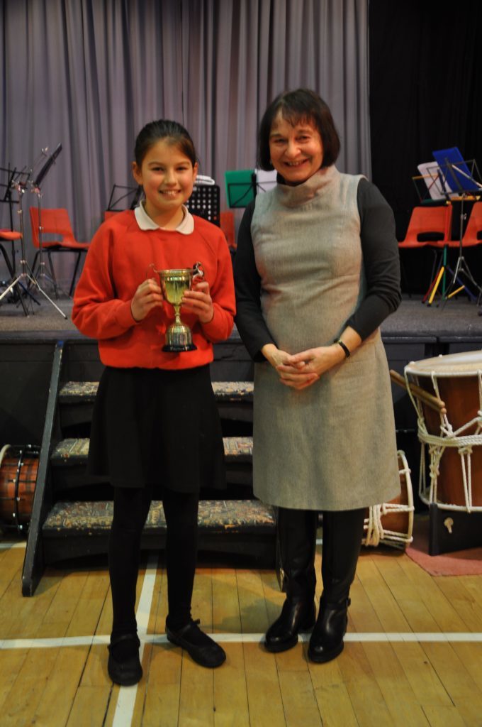 Daisy Innes and adjudicator Heather Gough with the Ormidale Cup for junior verse which she won for her Burns excerpt from Tam O'shanter