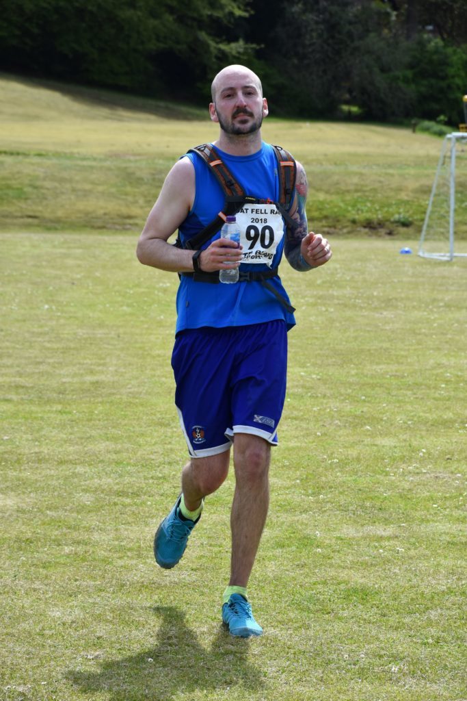 Arran's youth ambassador,  Graeme Johnston completes the race.