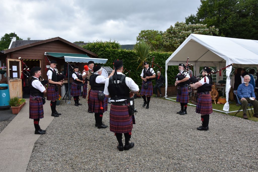 Making a welcome appearance, members of the Arran Pipe Band perform for the audience.
