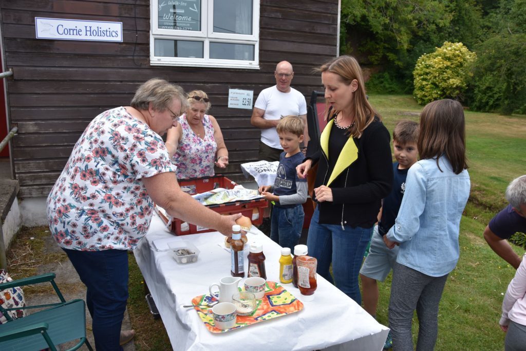 Marion Melvin, Linda MacCallum and Charlie Sclater ensure that all the visitors are well fed at their burger stall.