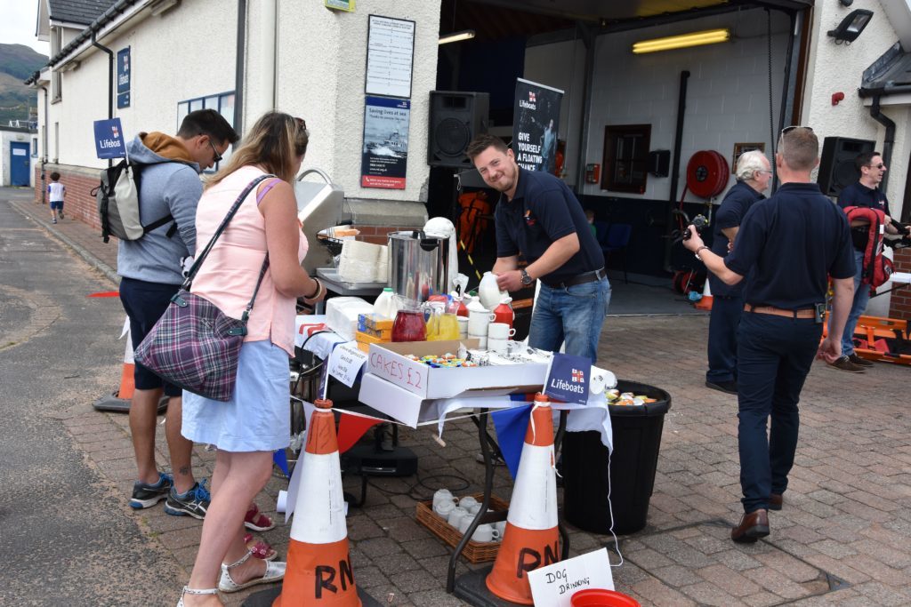 RNLI member Alexandru Cochiuban kept the visitors well fed at the burger and cake stand.