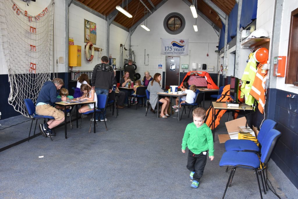 Children and parents enjoy fun activities and lunch in the lifeboat station.