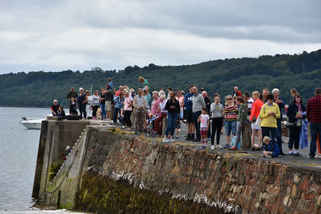 Visitors line the Lamlash pier to watch the lifeboat demonstration.