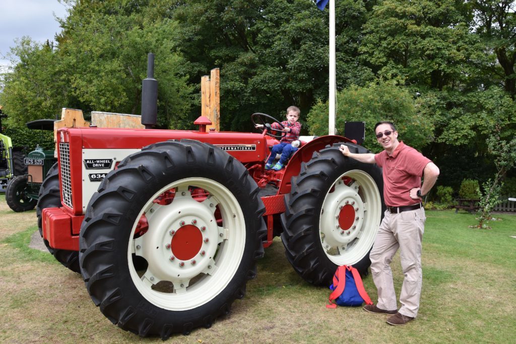 Four year old John and dad Brian Donlin inspect a rare International 634 tractor.