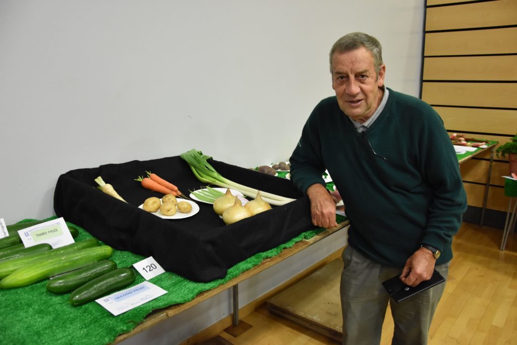 Excelling himself in vegetable growing, John O'Sullivan with his prize winning collection of vegetables.