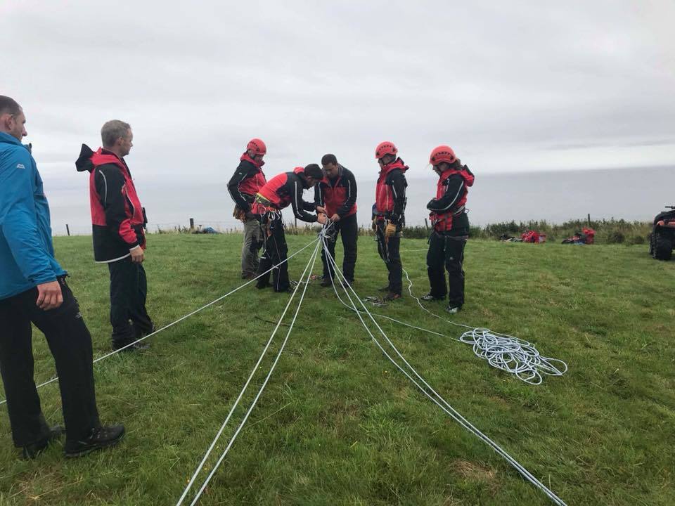 A rope system is secured to reach a crag-fast man located on the cliffs at Bennan Head. Photograph: Lucy and Iain, AMRT.