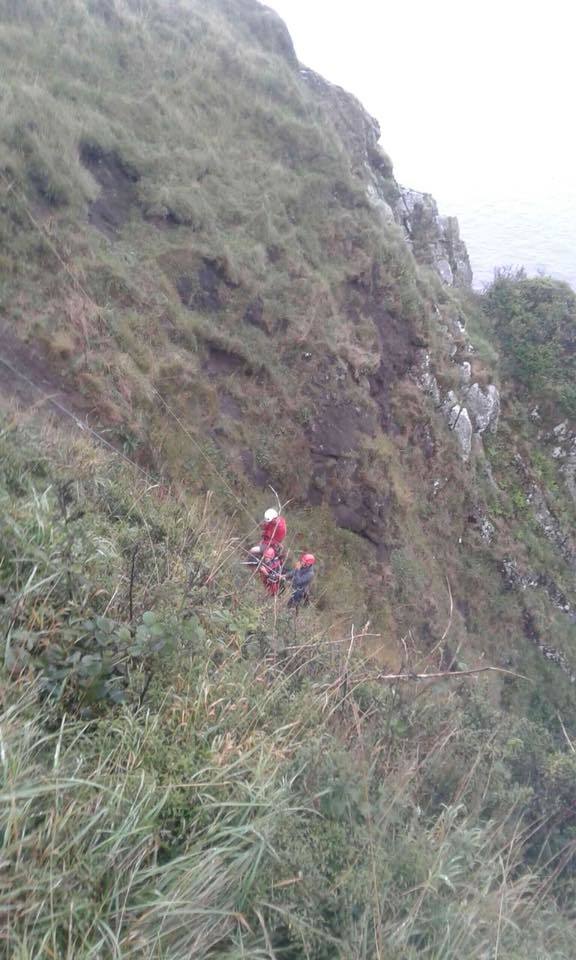 AMRT members descend the steep cliff to assist a trapped walker. Photograph: Lucy and Iain, AMRT.