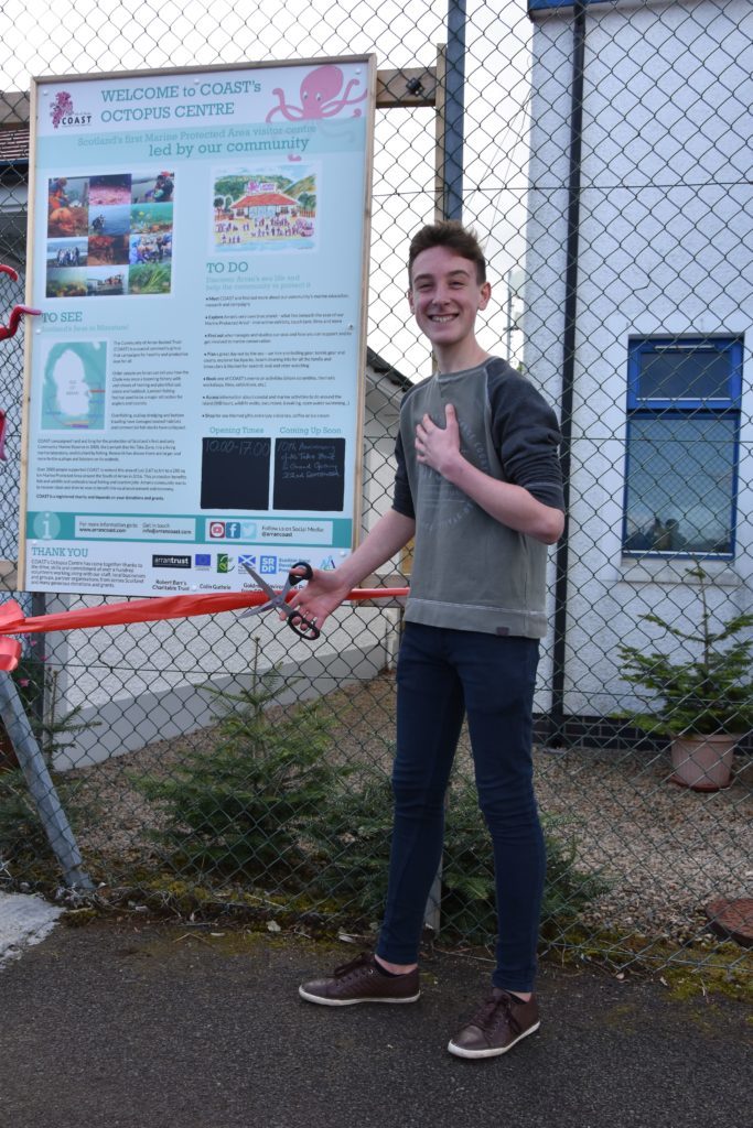COASTS youngest member Luke Nelson cuts the ribbon, officially opening the Octopus Centre.