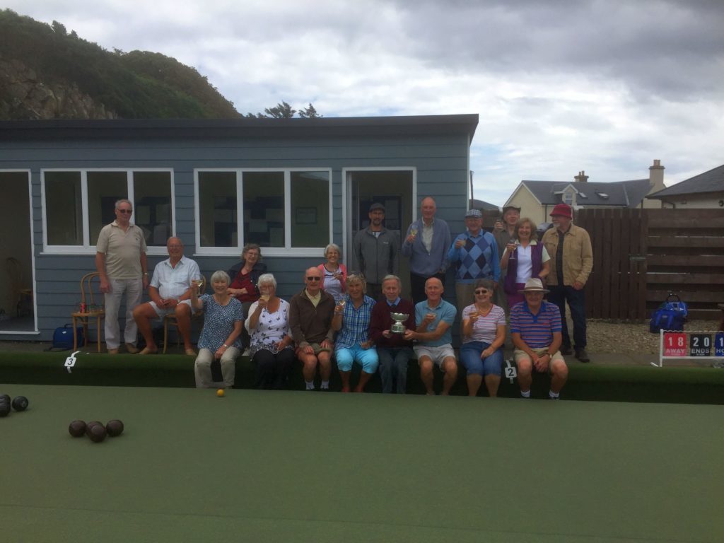 AUGUST - Blackwaterfoot bowlers join the Laidler-Gardner participants in celebrating their win for the first time in 14 years.