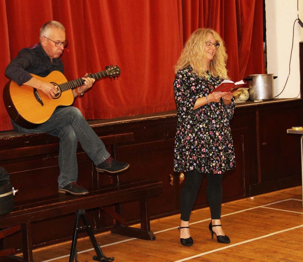 Nikki and Andy Surridge perform for the audience.