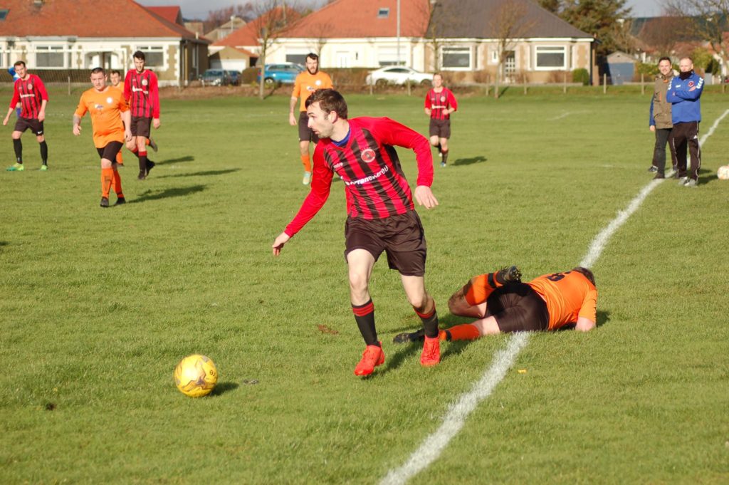 Eyes on the target, goal scorer Archie McNicol claims possession of the ball.
