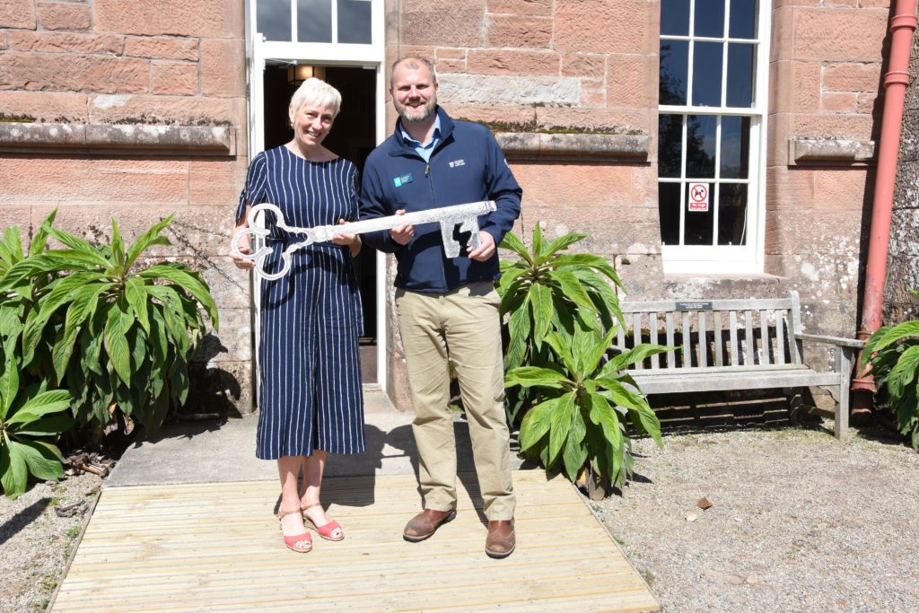 They key to the castle, Sheila Gilmore and Jared Bowers officially open the castle.