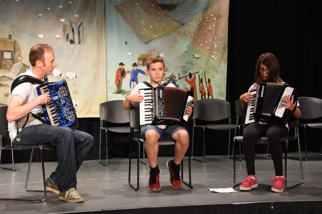 Concentrating on getting the notes right, John Somerville helps the accordion class deliver a flawless performance.