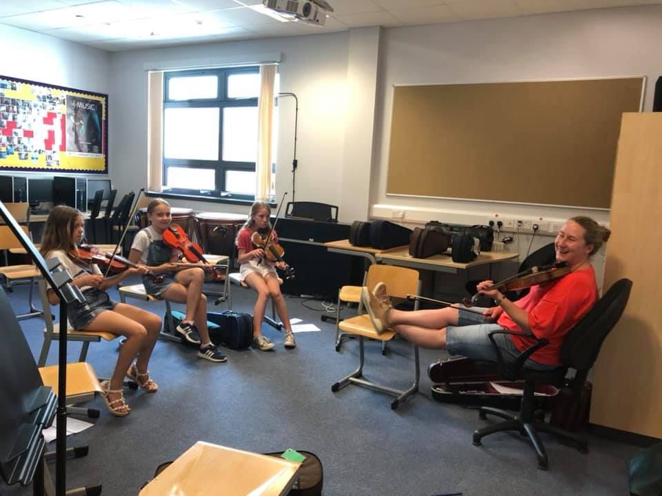 Gillian Frame shares a laugh with the pupils in her fiddle class.