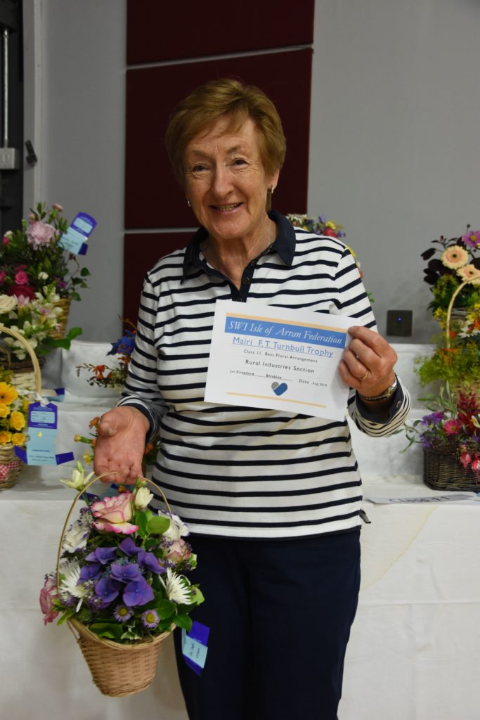 Jan Crawford is the first recipient of the new Mairi FT Turnbull Trophy for the best floral arrangement.