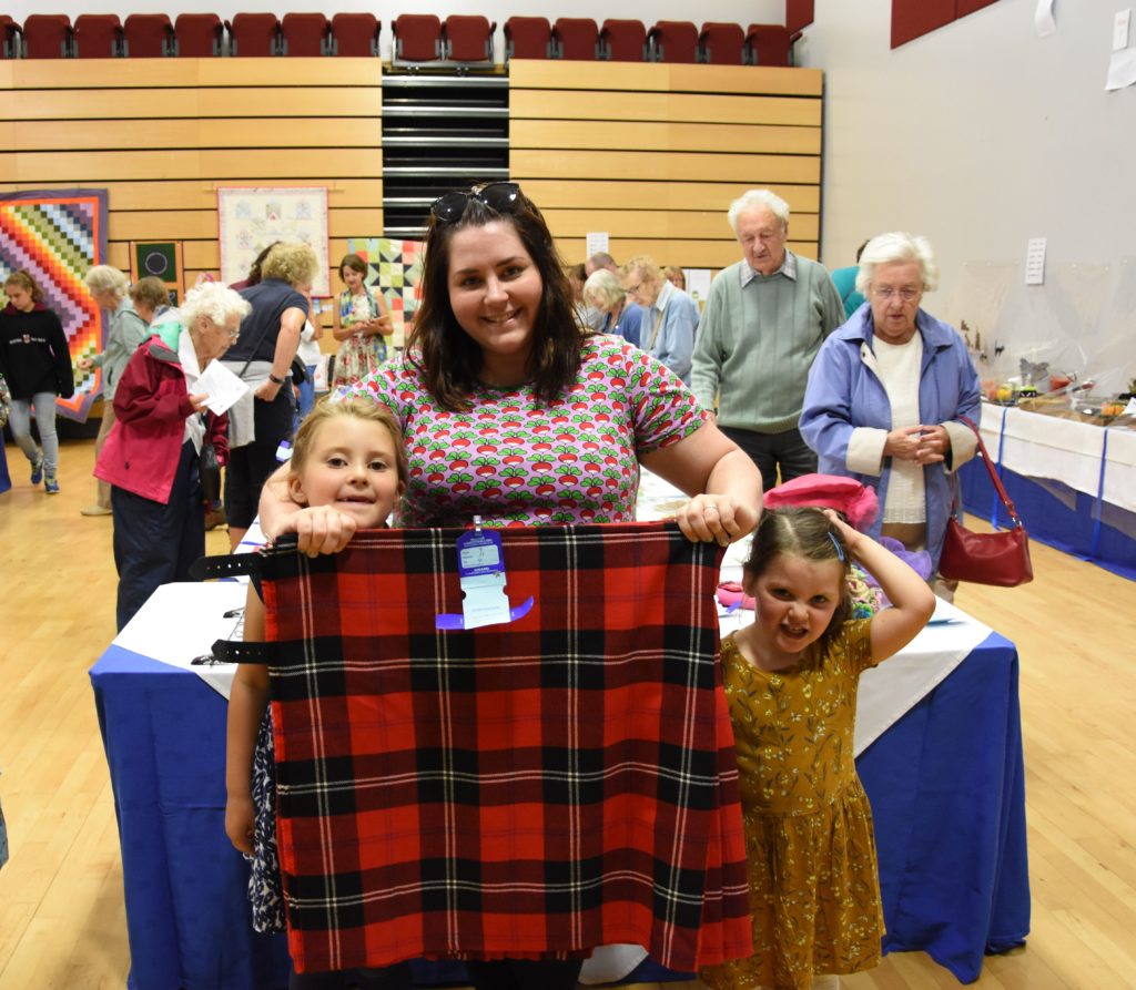 Jennifer Earle, joined by daughters Trixie and Rowan, received a silver award for her kilt.