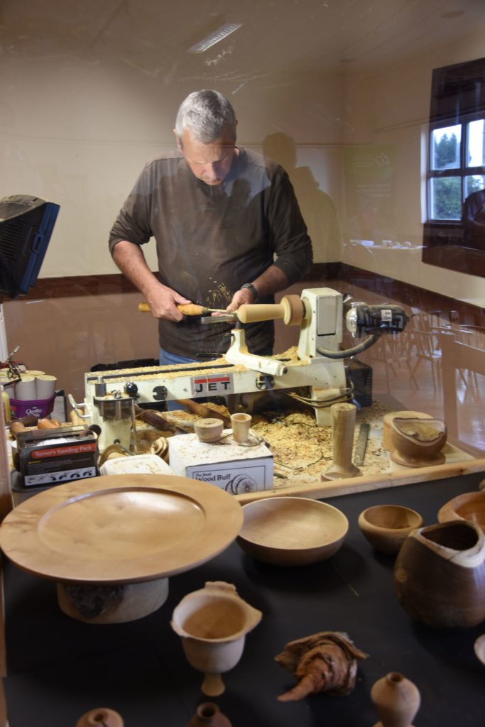 Graham McArthur of Rosa Wood works on his lath creating bowls, ornaments and items of interest.