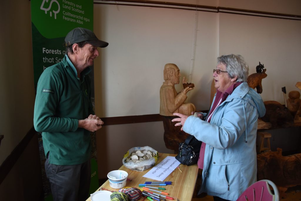 Bob Logan, wildlife ranger for the Forestry Commission speaks to a visitor about forests on Arran.