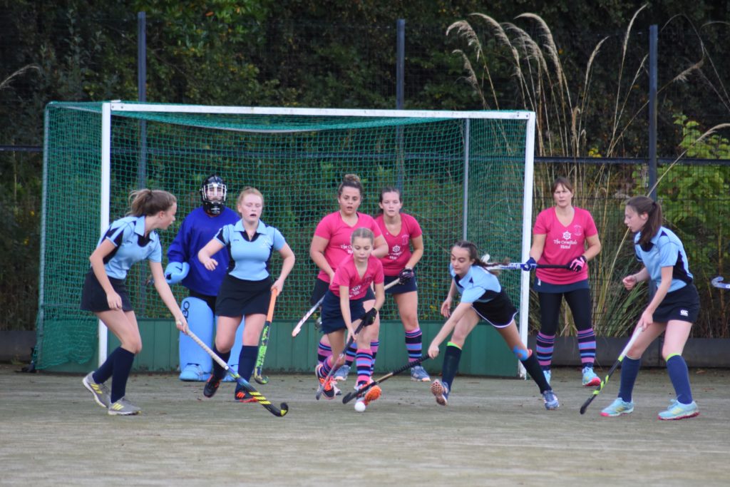 Dame of the game Annie McKelvie removes the ball from her defensive D despite tough opposition from Troon.