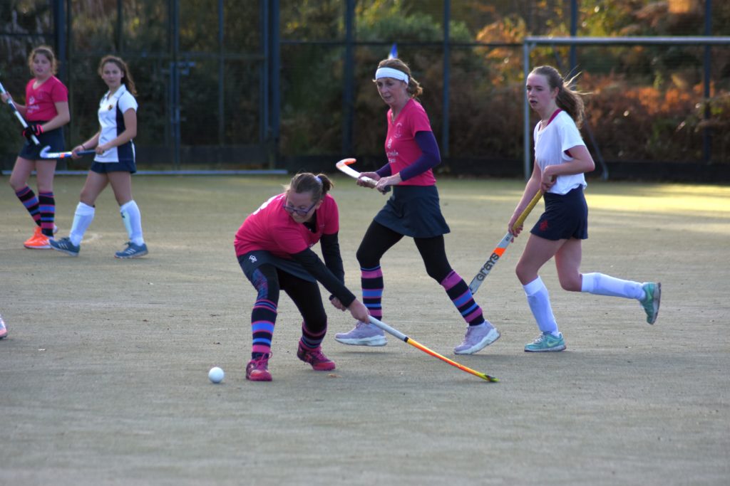 Mia Walker in centre mid position blasts the ball down the field towards the forwards.
