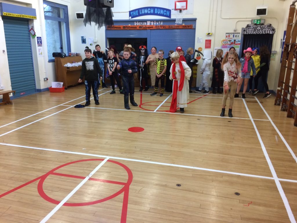 P5 to P7 pupils at Brodick Primary School play Hallowe’en games.