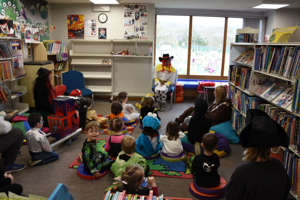 Brodick Nursery pupils listen to a scary story at Brodick Library’s Bookbug meeting.