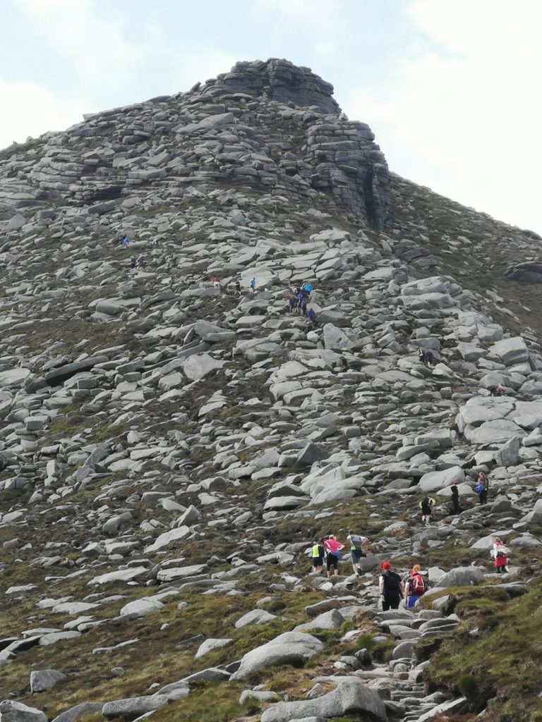Participants scale Goatfell during the 2019 challenge.