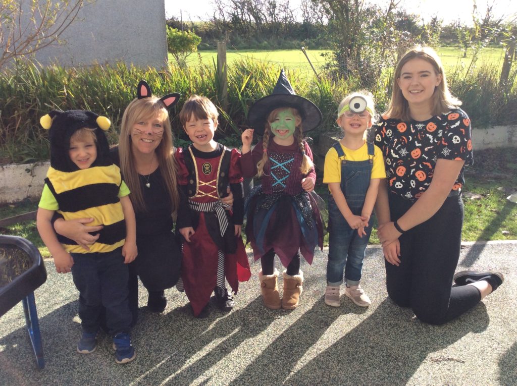 Wee witches, a bee and a minion join teachers at Kilmory Early Years.