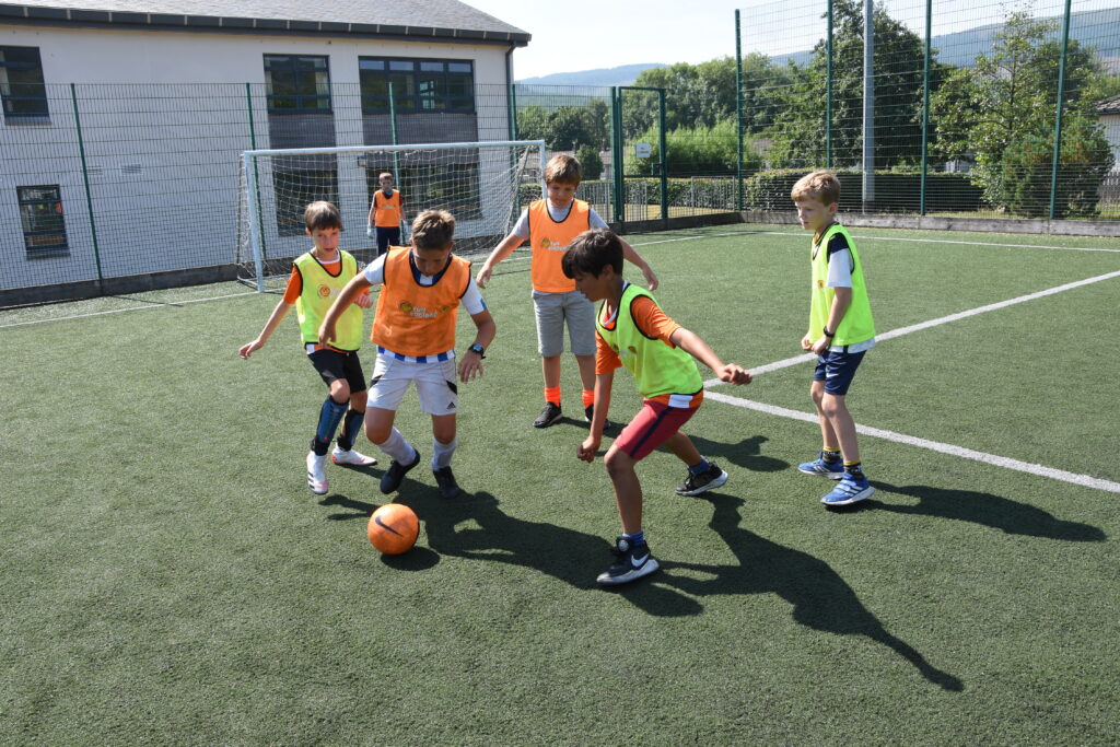 A dribbling defender under close attention of the opposition.