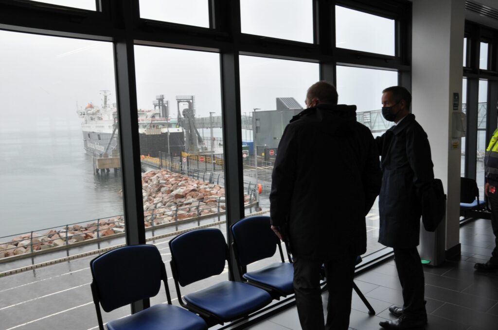The minister and Mr Drummond inspect the pier on a dreich day on Arran.