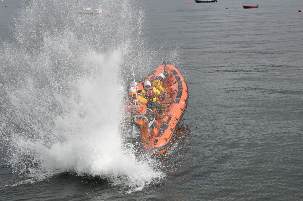 The RNLI lifeboat makes a splash with a short burst of its motors to celebrate the victory.