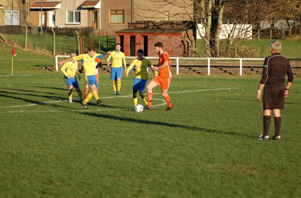Goal-scorer Ryan Armstrong claims possession of the ball.