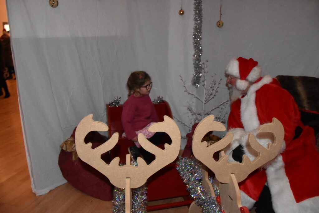 Little Annie Duncan tells Santa what she wants for Christmas.
